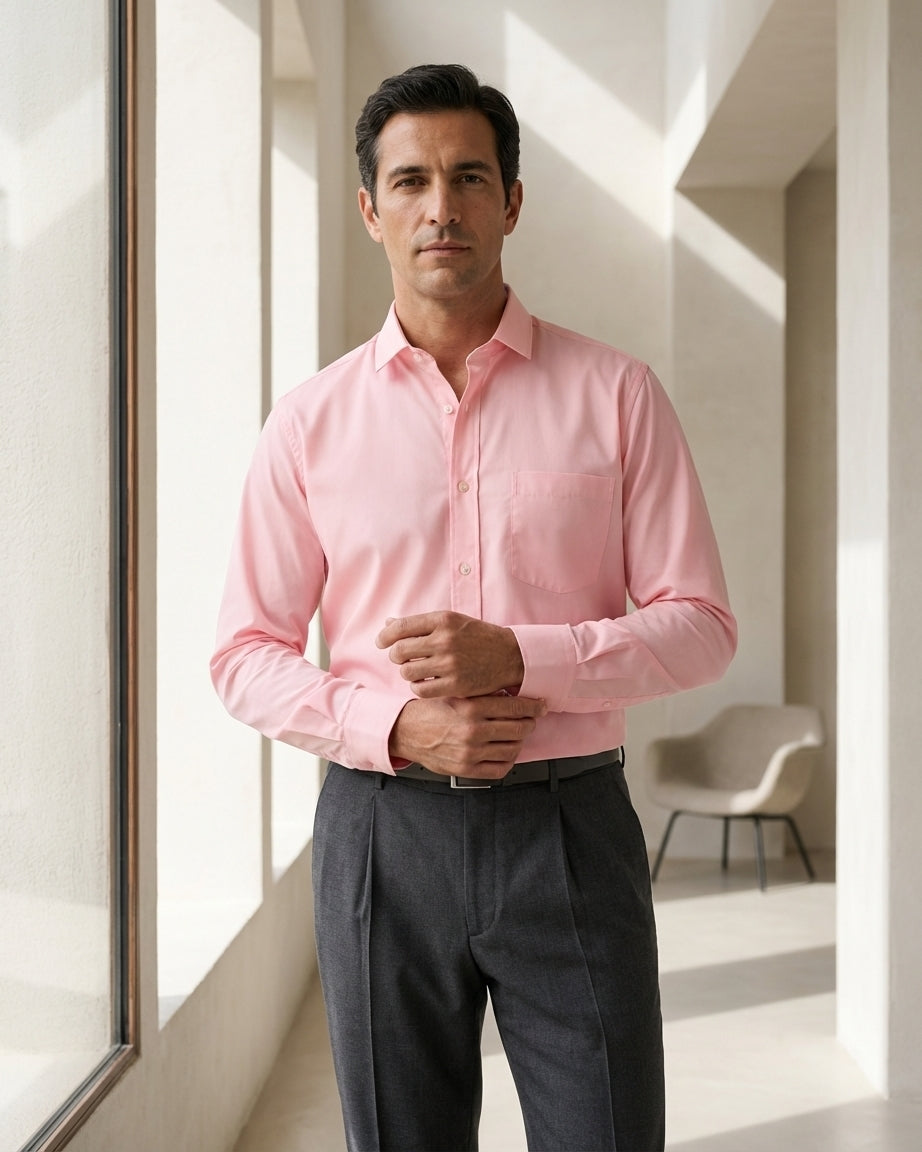Lifestyle image of man wearing blush pink premium polyester cotton regular fit shirt by Ekrangi
