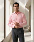 Lifestyle image of man wearing blush pink premium polyester cotton regular fit shirt by Ekrangi