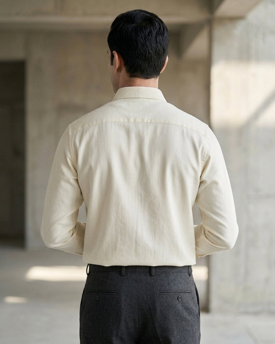 Lifestyle image of man wearing buttercream yelllow premium cotton regular fit shirt by Ekrangi