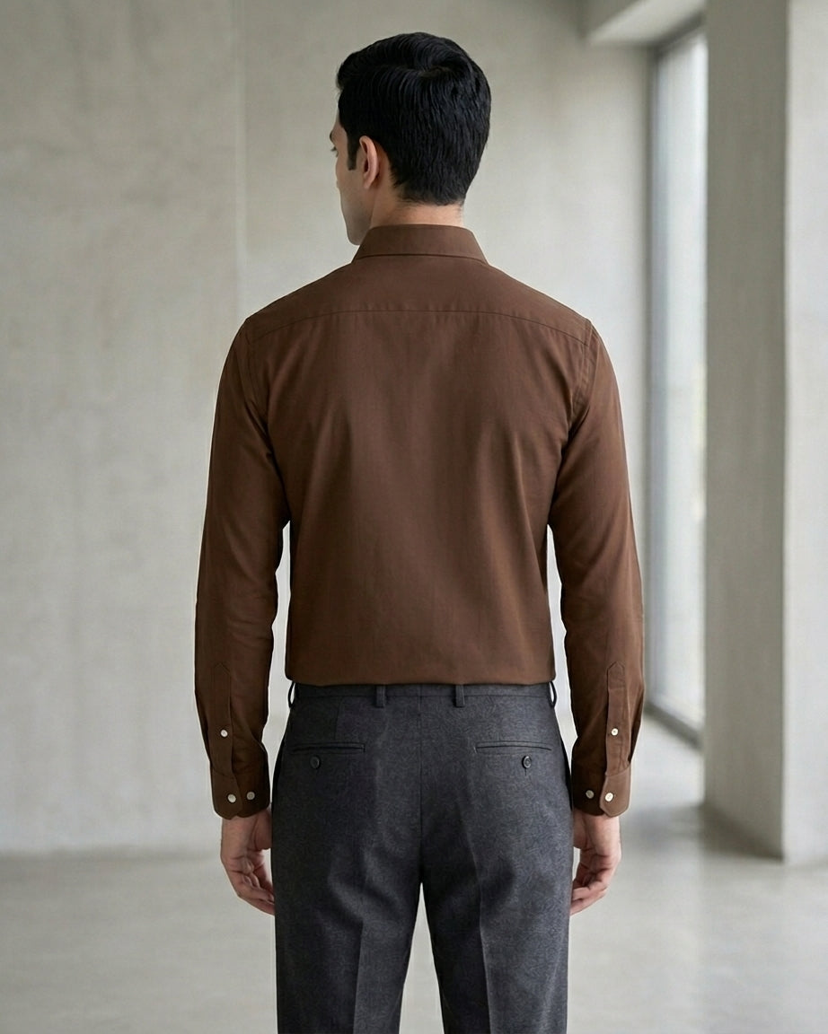 Lifestyle image of man wearing cocoa brown premium polyester cotton regular fit shirt by Ekrangi