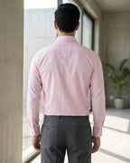 Lifestyle image of man wearing dusty pink premium cotton regular fit shirt by Ekrangi