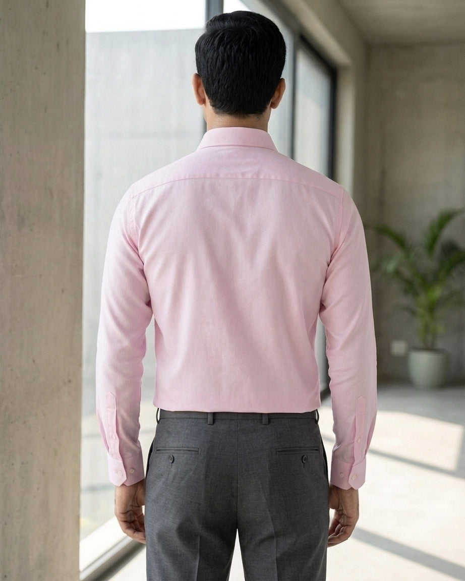 Lifestyle image of man wearing dusty pink premium cotton regular fit shirt by Ekrangi