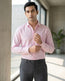 Lifestyle image of man wearing dusty pink premium cotton regular fit shirt by Ekrangi