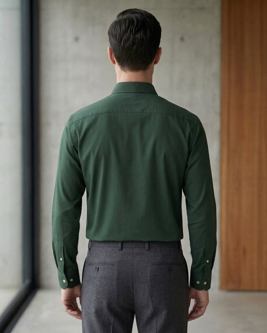 Lifestyle image of man wearing emerald green premium cotton regular fit shirt by Ekrangi