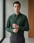 Lifestyle image of man wearing emerald green premium cotton regular fit shirt by Ekrangi