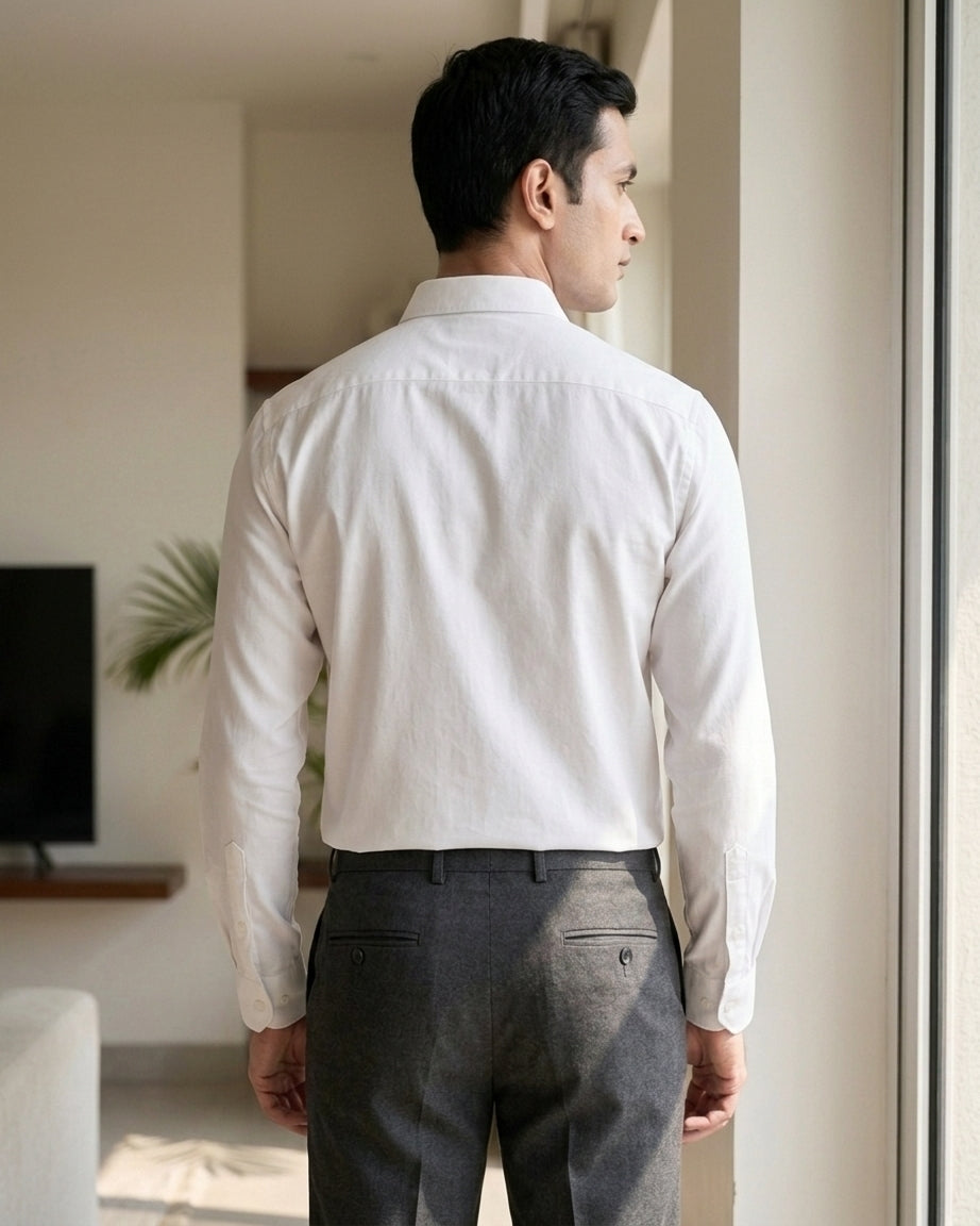 Lifestyle image of man wearing frost white premium cotton regular fit shirt by Ekrangi