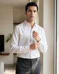 Lifestyle image of man wearing frost white premium cotton regular fit shirt by Ekrangi