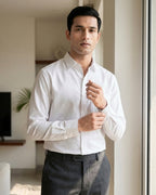 Lifestyle image of man wearing frost white premium cotton regular fit shirt by Ekrangi