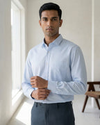 Lifestyle image of man wearing haze blue premium polyester cotton regular fit shirt by Ekrangi