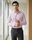 Lifestyle image of man wearing heirloom lavender cotton sateen regular fit shirt by Ekrangi