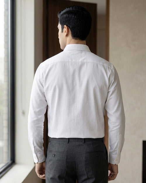 Lifestyle image of man wearing ivory white premium polyester cotton regular fit shirt by Ekrangi