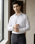 Lifestyle image of man wearing ivory white premium polyester cotton regular fit shirt by Ekrangi