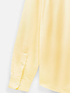 Close-up of fabric of men’s marigold yellow premium cotton shirt by Ekrangi