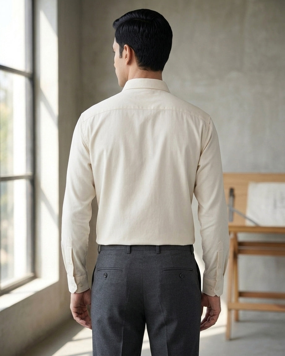 Lifestyle image of man wearing metro white premium cotton regular fit shirt by Ekrangi