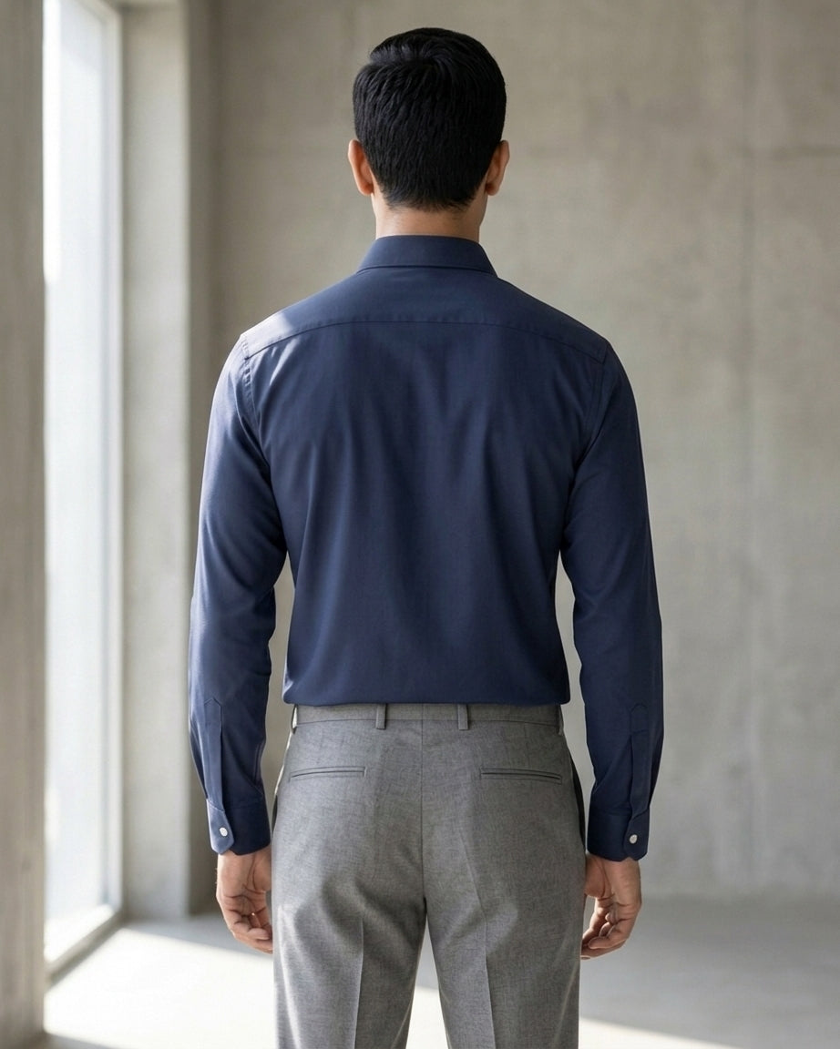 Lifestyle image of man wearing midnight blue premium cotton regular fit shirt by Ekrangi