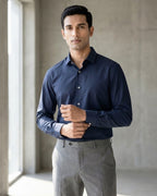 Lifestyle image of man wearing midnight blue premium cotton regular fit shirt by Ekrangi