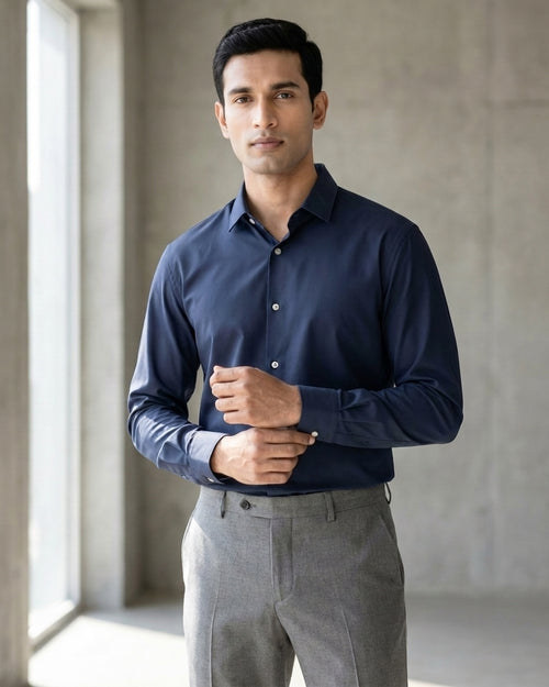 Lifestyle image of man wearing midnight blue premium cotton regular fit shirt by Ekrangi