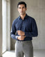 Lifestyle image of man wearing midnight blue premium cotton regular fit shirt by Ekrangi