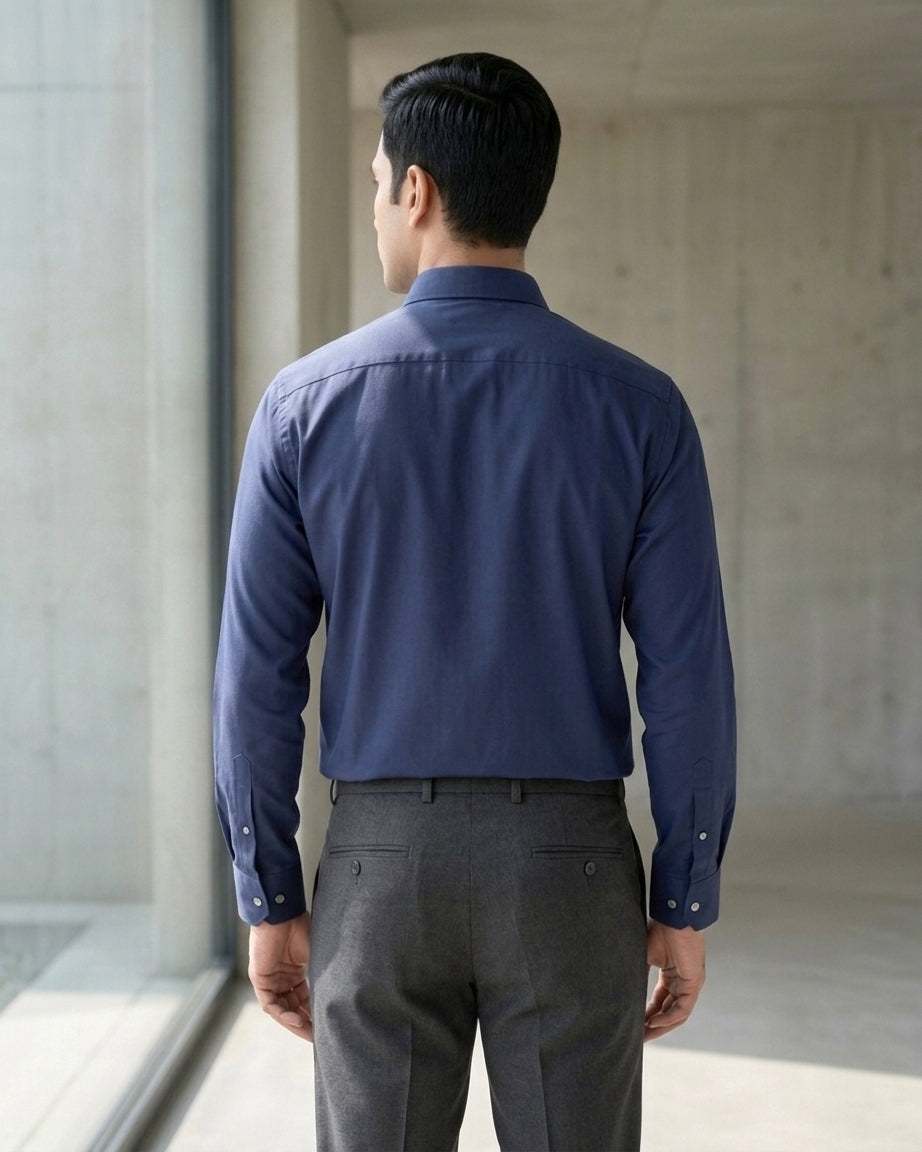 Lifestyle image of man wearing obsidian blue premium polyester cotton regular fit shirt by Ekrangi