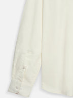 Close-up of fabric of men’s pearl yellow cotton sateen shirt by Ekrangi