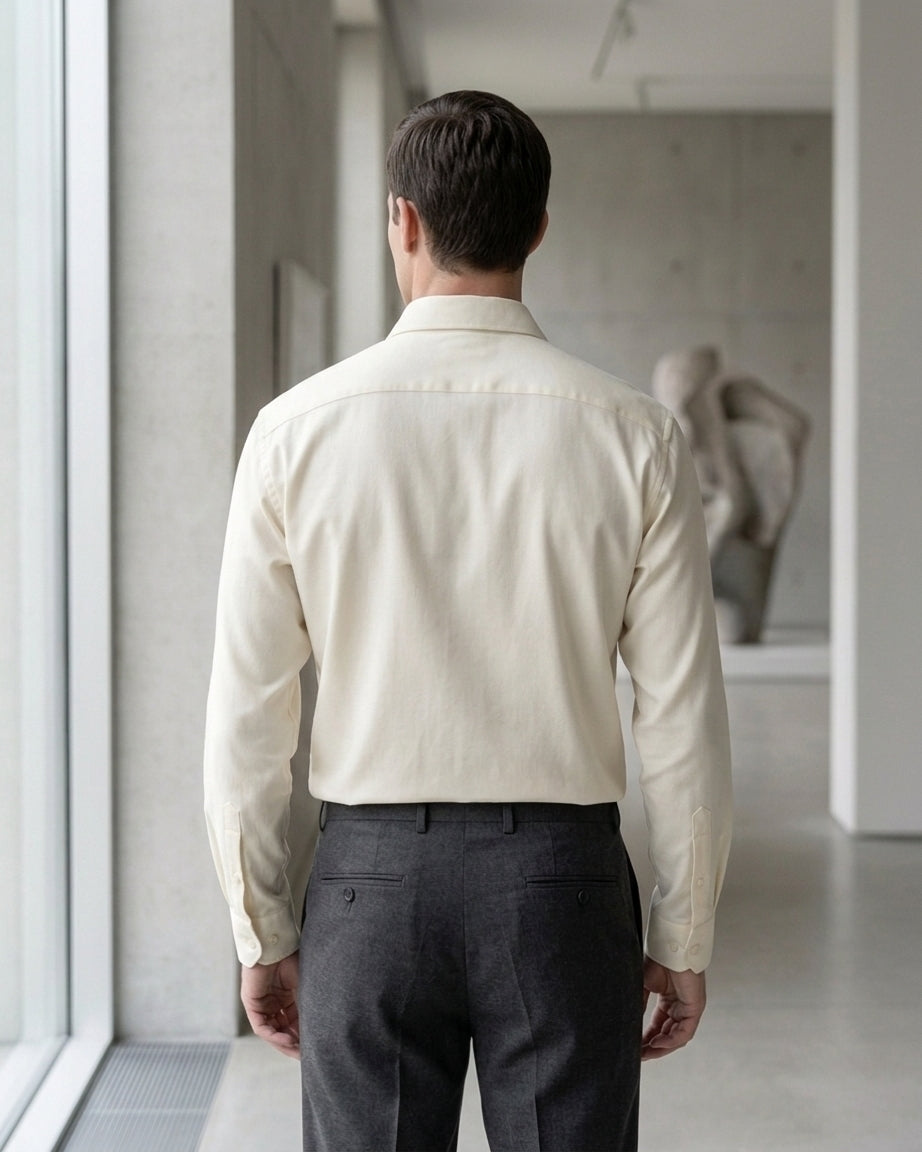 Lifestyle image of man wearing pearl yellow cotton sateen regular fit shirt by Ekrangi