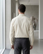 Lifestyle image of man wearing pearl yellow cotton sateen regular fit shirt by Ekrangi