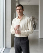 Lifestyle image of man wearing pearl yellow cotton sateen regular fit shirt by Ekrangi
