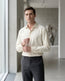Lifestyle image of man wearing pearl yellow cotton sateen regular fit shirt by Ekrangi