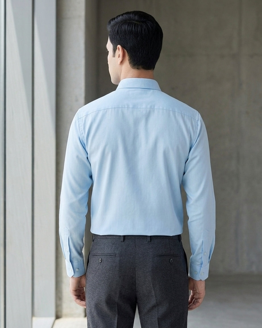Lifestyle image of man wearing serene blue premium polyester cotton regular fit shirt by Ekrangi
