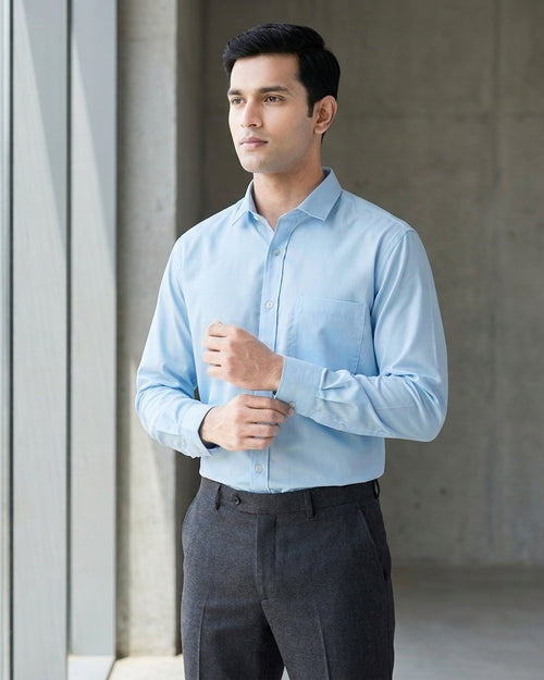 Lifestyle image of man wearing serene blue premium polyester cotton regular fit shirt by Ekrangi