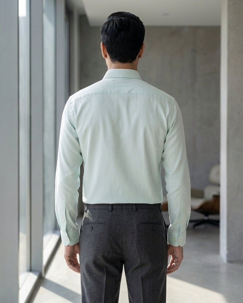 Lifestyle image of man wearing skyline blue premium cotton regular fit shirt by Ekrangi