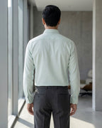 Lifestyle image of man wearing skyline blue premium cotton regular fit shirt by Ekrangi