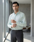 Lifestyle image of man wearing skyline blue premium cotton regular fit shirt by Ekrangi