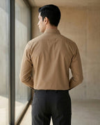 Lifestyle image of man wearing taupe brown premium polyester cotton regular fit shirt by Ekrangi