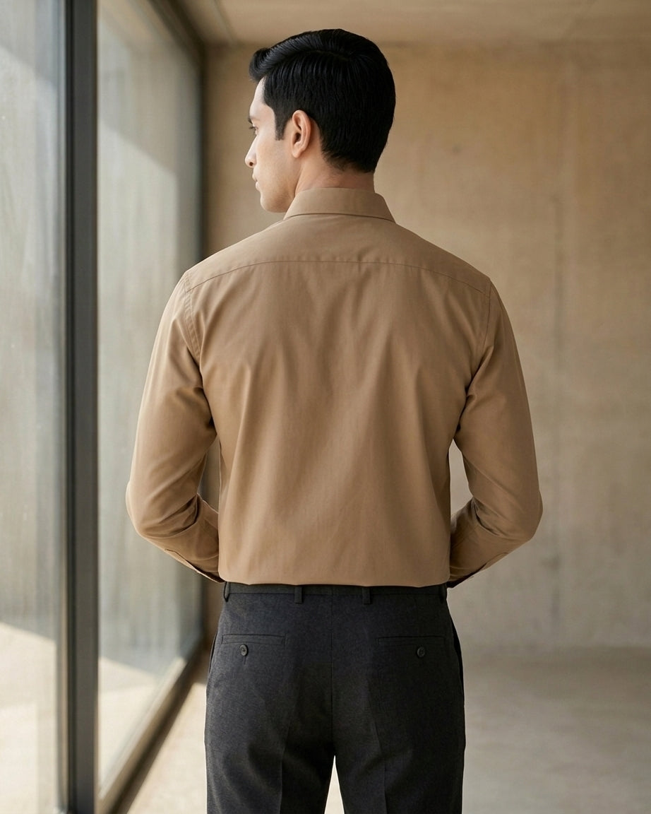 Lifestyle image of man wearing taupe brown premium polyester cotton regular fit shirt by Ekrangi
