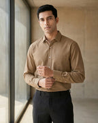 Lifestyle image of man wearing taupe brown premium polyester cotton regular fit shirt by Ekrangi